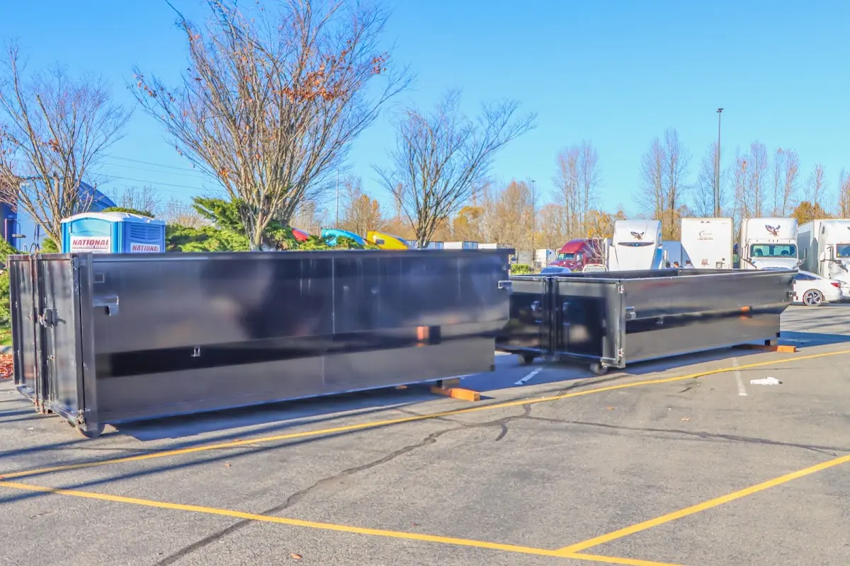 Professional dumpster rental service with roll-off container on residential driveway in Streetsboro